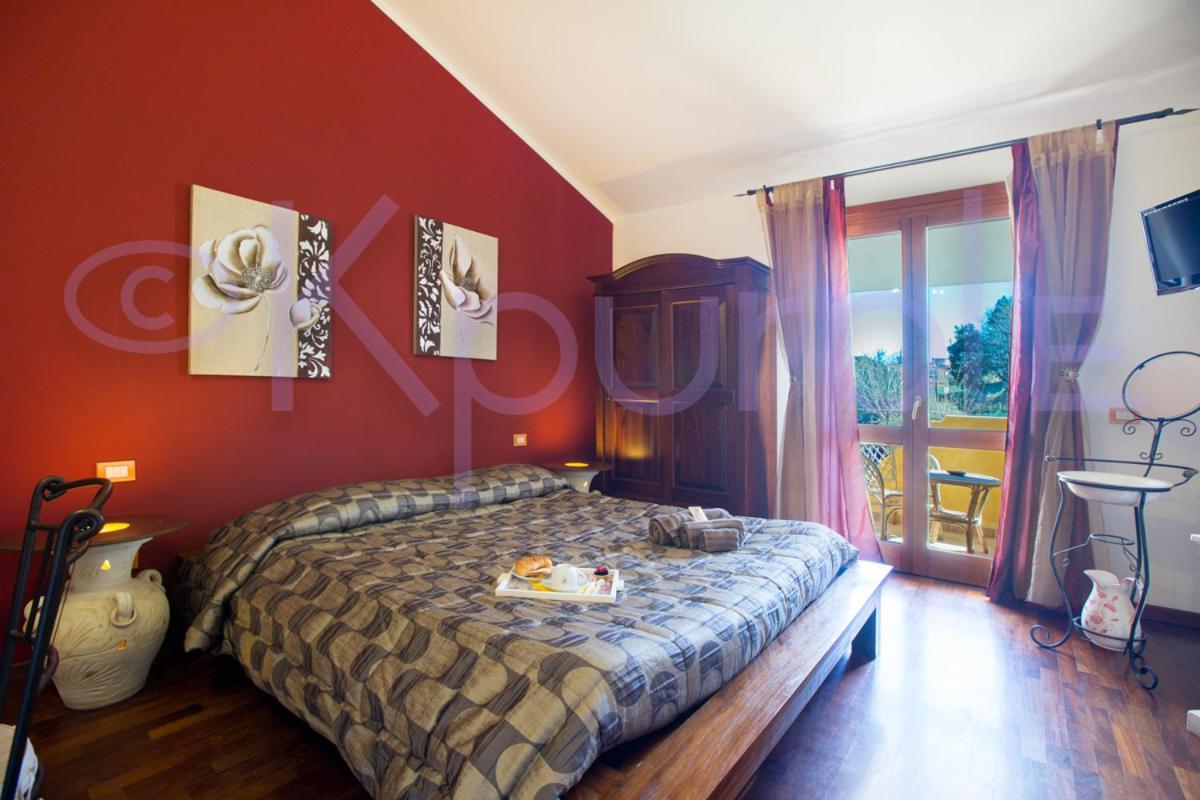 Le Api Hotel Cagliari Bagian luar foto